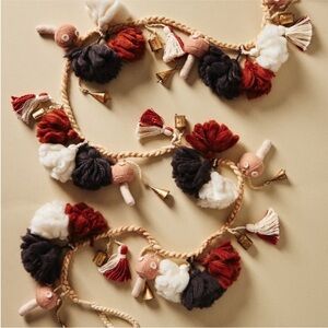 Anthropologie Festive Pom Garland with bells and mushrooms